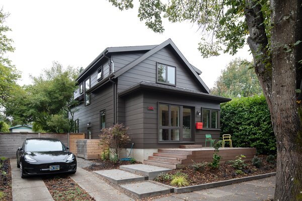 The renovation added a new foyer in the place of its front porch, and expanded the attic-like upstairs into a full second floor.