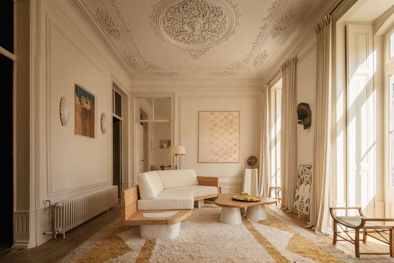 Garcé & Dimofski preserved this Lisbon apartment’s intricate 19th-century details while filling it with fresh light fixtures, wood paneling, and Portuguese marble.