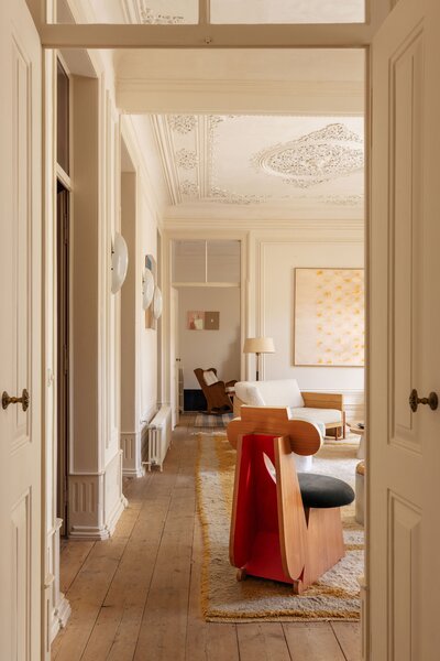 Architectural charm, such as original flooring and ornate moldings, await in every room.