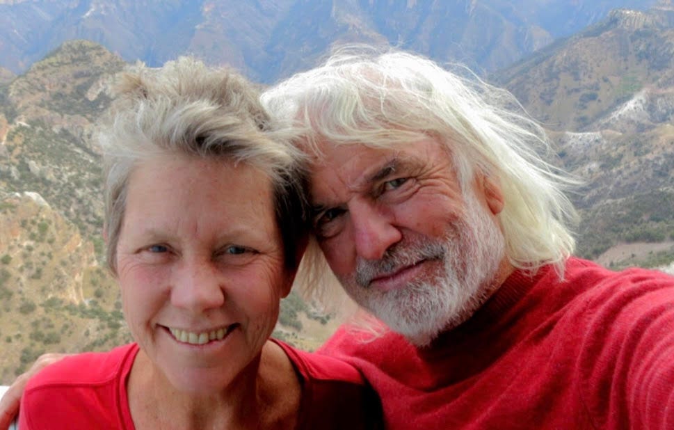 Louisa and Barry wearing red shirts while traveling.