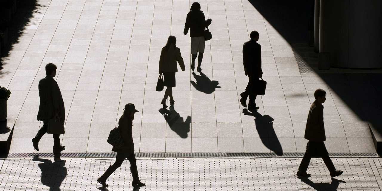 People walking on a sidewalk