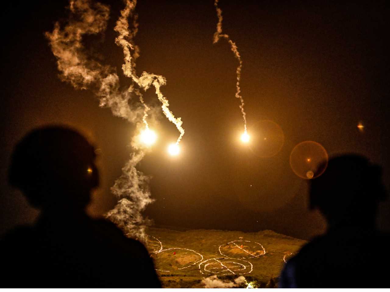 Taiwanese soldiers stand guard as flares are fired during a Taiwanese military live-fire drill, after Beijing increased its military exercises near Taiwan, in Pingtung, Taiwan, 6 September 2022.