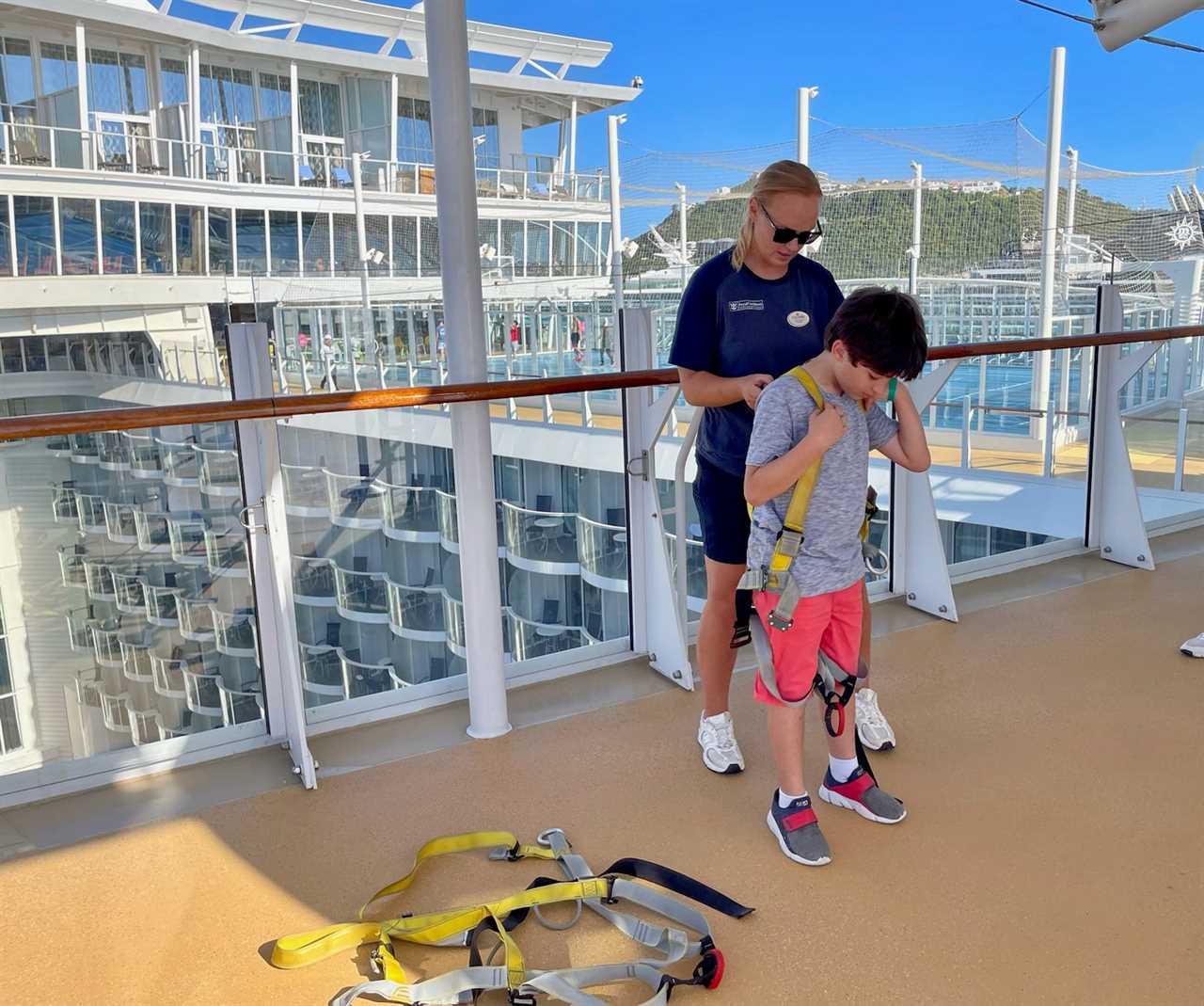 Author's son being strapped into cruise ship zipline