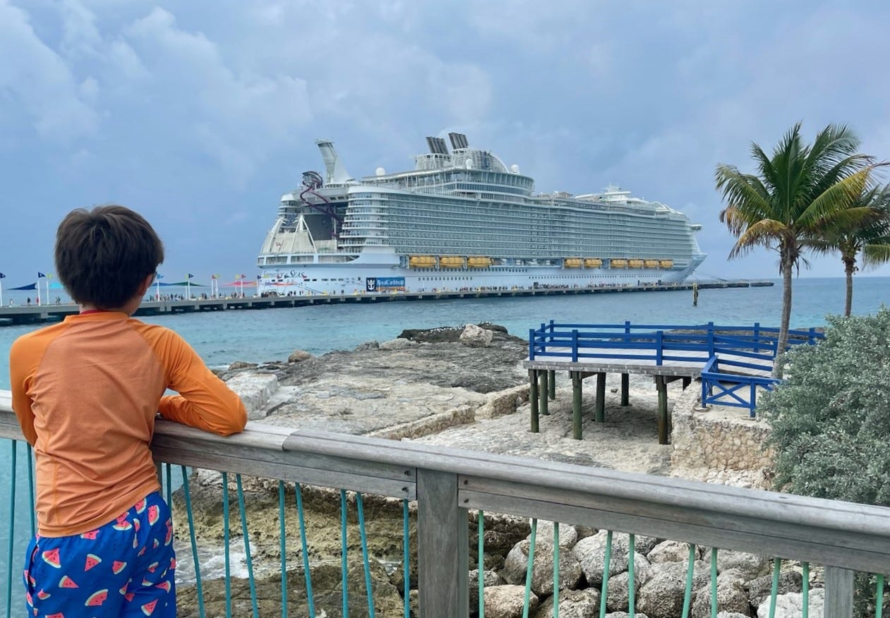 Author's son looking out at cruise ship 