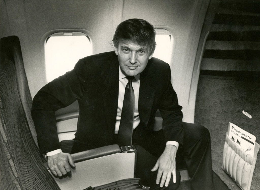 Donald Trump in the seat of one of his Trump Shuttle airplanes.