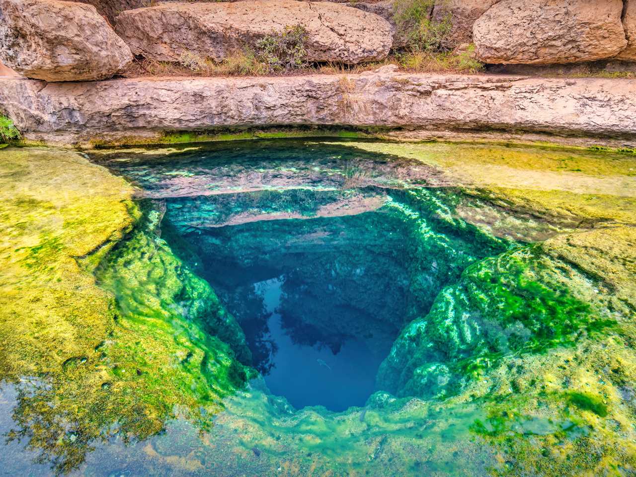 Jacob's Well, a karstic spring and waterhole in the Texas Hill Country flowing from the bed of Cypress Creek near Austin, Texas, USA