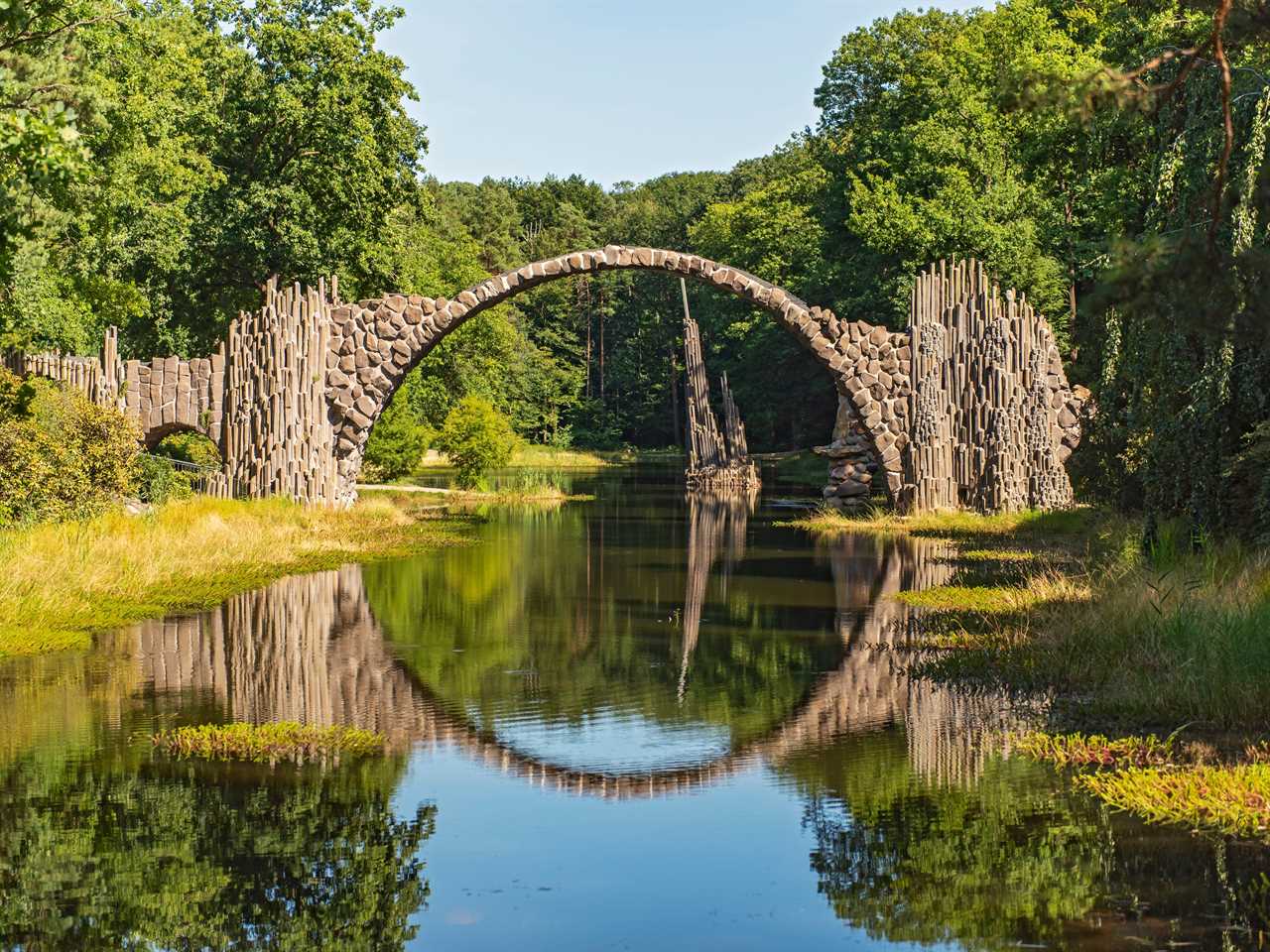 Rakotzbrucke, or Devil's Bridge, in Germany creates a perfect circle with its own reflection.