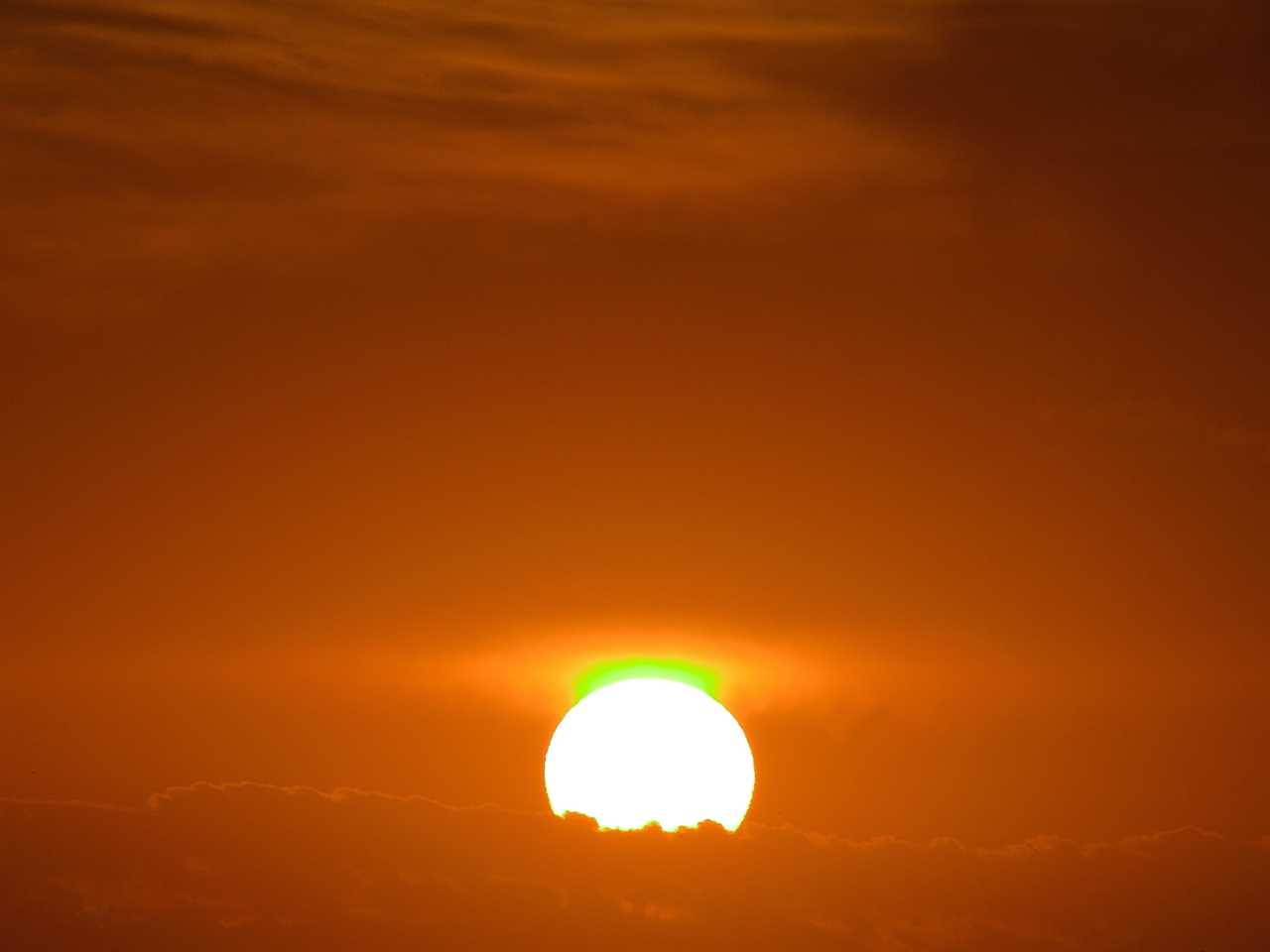 Green flash is seen as the sun sets.