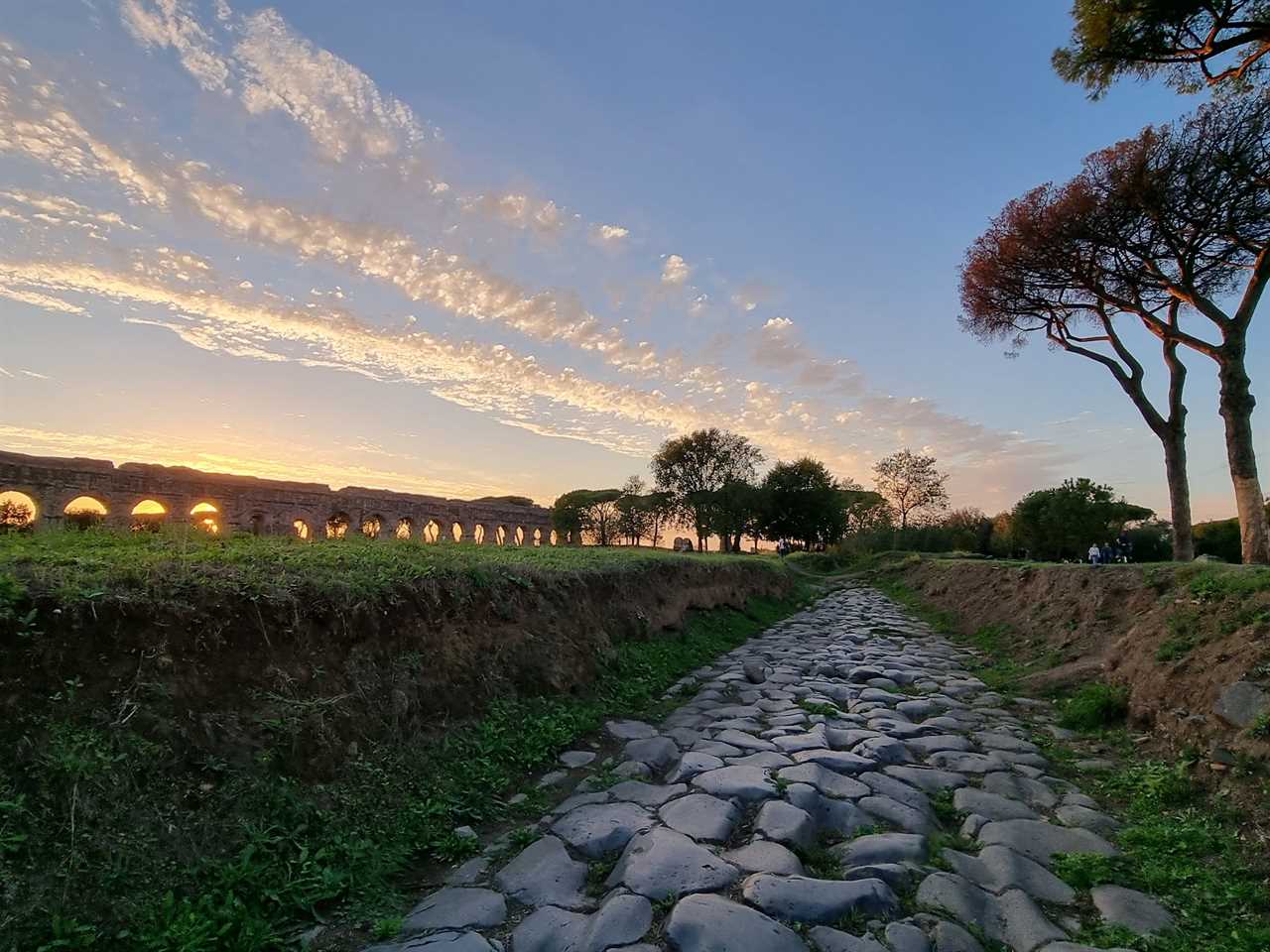 view of the park of the aqueducts in rome at sunset