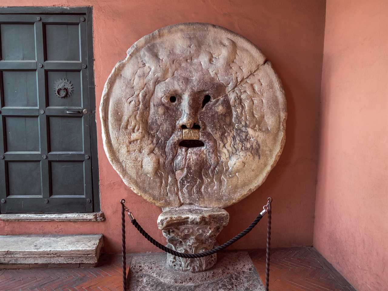 shot of the mouth of truth sculpture in rome