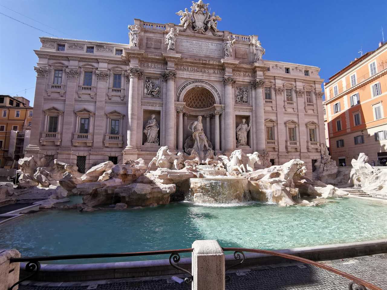 beautiful straight-on view of the trevi fountain in rome