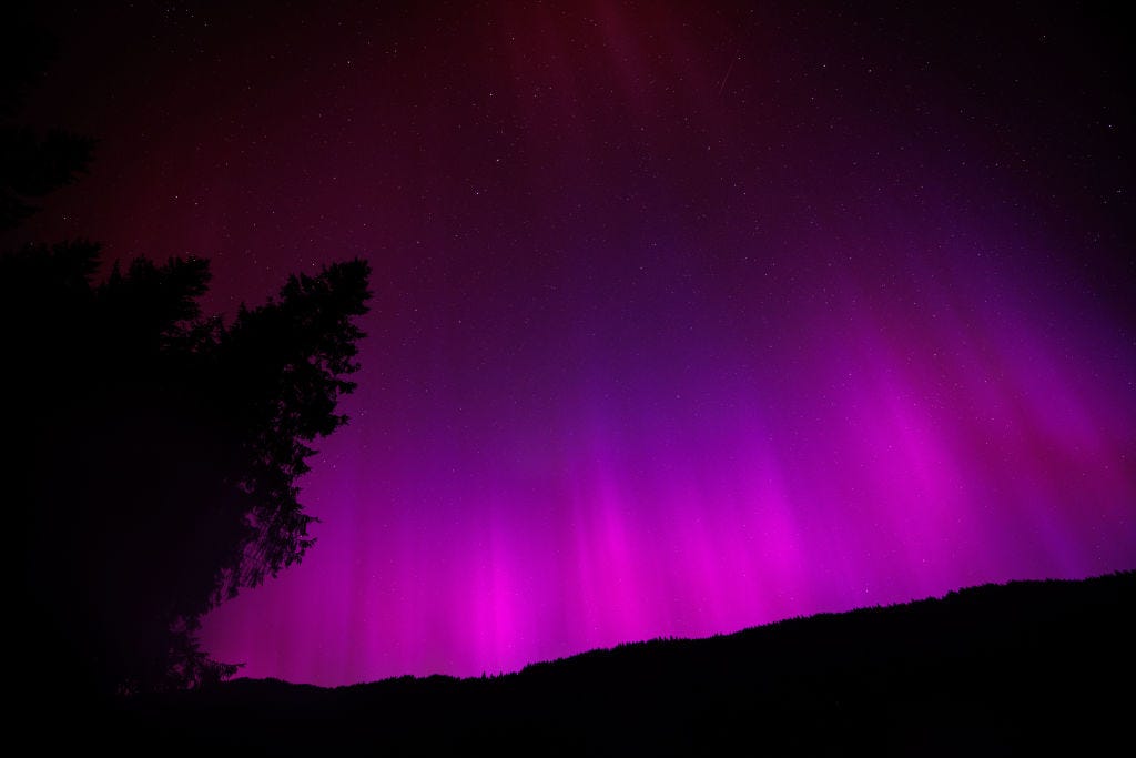 11 May 2024, Bavaria, Krün: Northern lights (aurora borealis) flicker in the night sky above Wagenbrüchsee near Krün (Bavaria) on May 11, 2024. Photo: Matthias Balk/dpa (Photo by Matthias Balk/picture alliance via Getty Images)