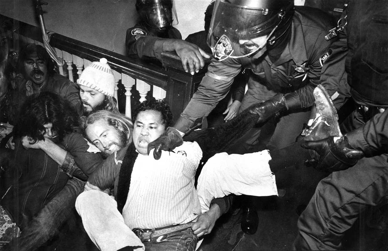 International Hotel, San Francisco, Chinatown. Controversial evictions and protests, demonstrations. The eviction. Emil de Guzman, tenants association secretary, resisting being dragged from the second floor of the hotel.