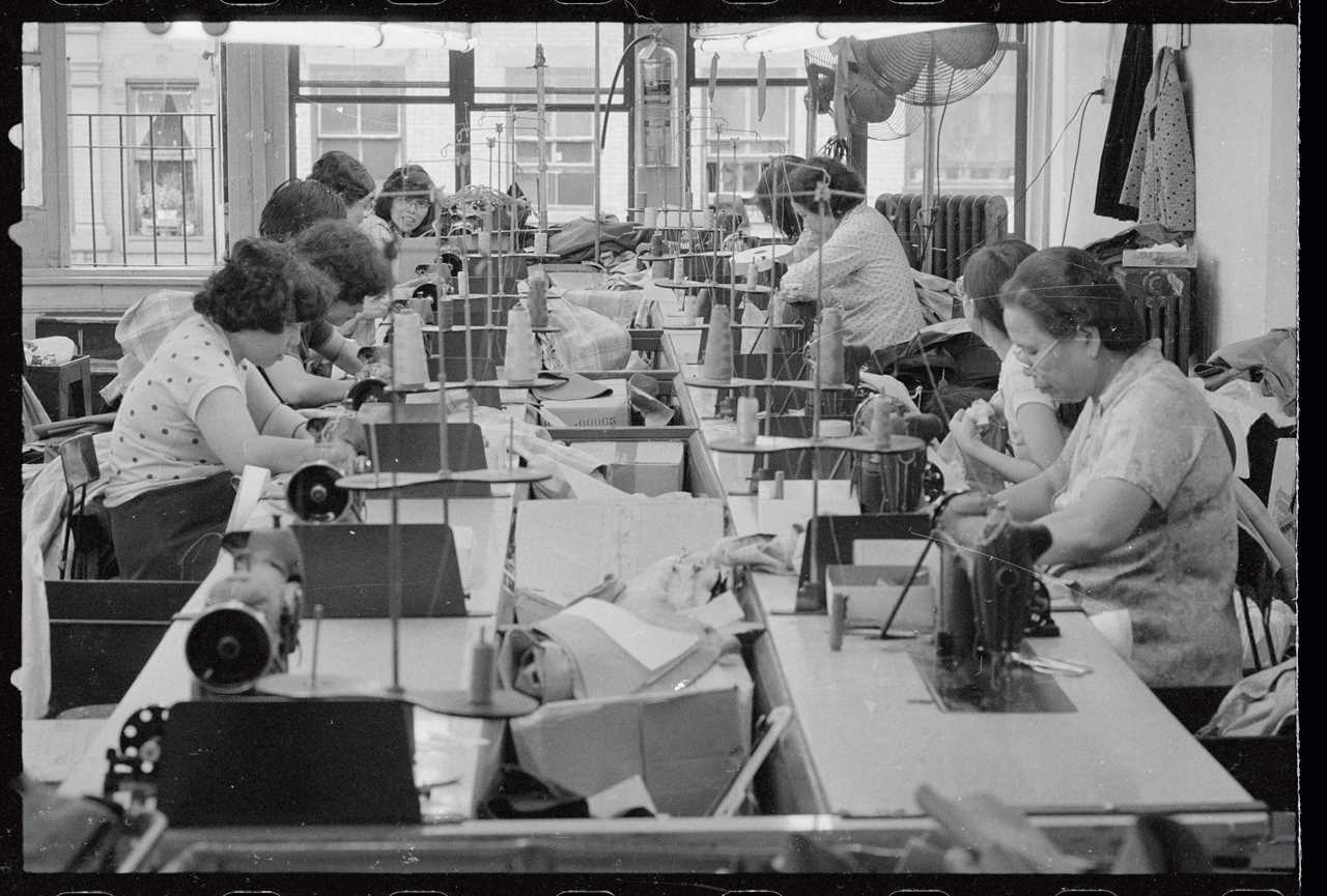 Asian women ply their trade in a Chinatown garment factory.