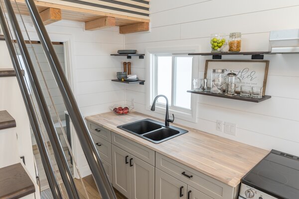 Birch plywood is used for the kitchen cabinetry, and Acacia wood for the butcherblock countertops.