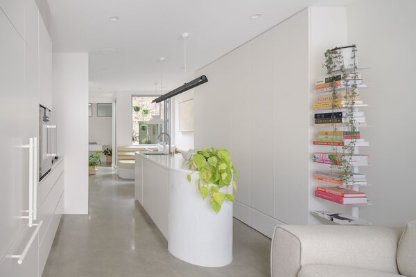 With white polyurethane joinery and polished concrete floors, light bounces around the small space.