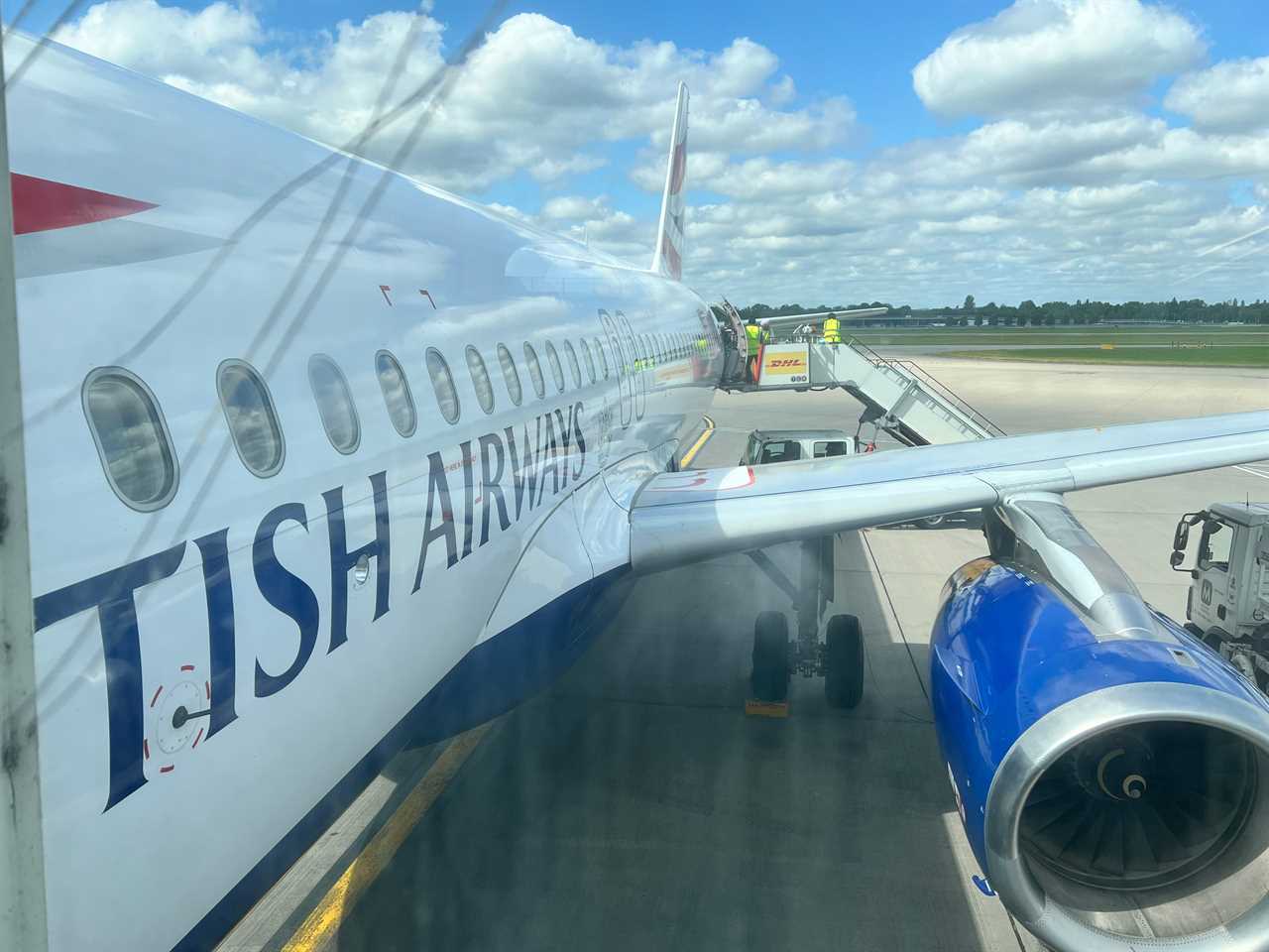 A British Airways Airbus A320 as viewed from the side from a jet bridge.