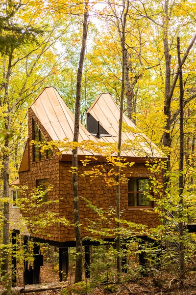 The Copper Fox Treehouse Airbnb rental is located on the owners’ six-acre wooded property near Bradbury Mountain State Park in Maine.