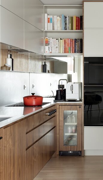 Leah placed a mirror in the kitchen side splash to extend the space and reflect natural light from the front windows.