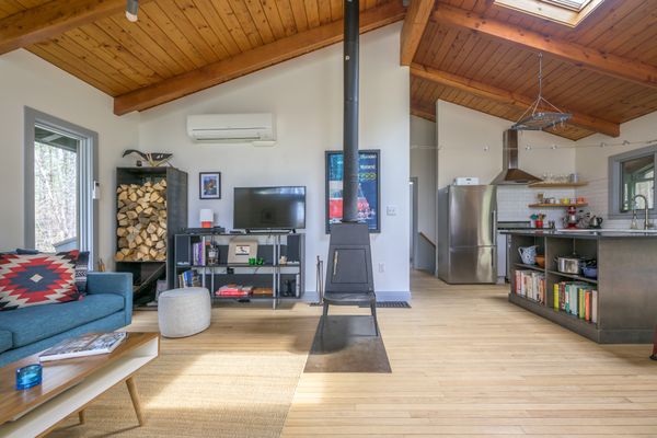The living room is heated with a Wittus Shaker wood stove.