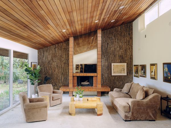 The home has a sloping redwood ceiling.