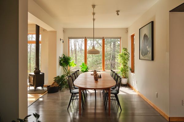 The living room is heated in part by a wood stove.