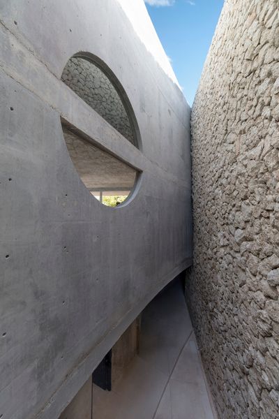 Walls meet in unconventional ways in a home that feels alive and playful at every turn.