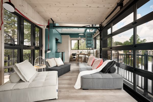 The ground level features an open kitchen, dining, and living area.