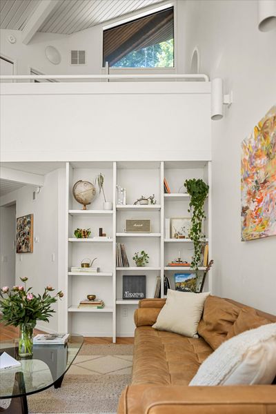 The second-floor hallway overlooks the living room's double-height ceilings.