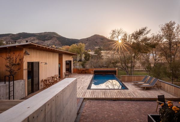 The pool house was designed by Davis Urban. It overlooks a Conex shipping container pool that Nathaniel sourced.