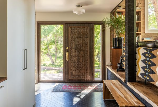 Inspired by a Moroccan design Nathaniel discovered, the front door was custom-made by a local craftsperson to fit the space.