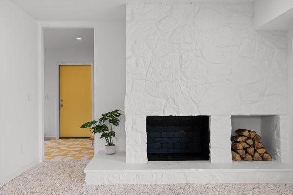 The first-floor living room features a wood-burning fireplace.