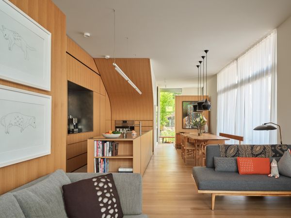 The couple live on the ground floor of the main building and in the two-story laneway house located across a paved terrace. In the future, the laneway house can be turned into a separate apartment, to create a total of five condos.