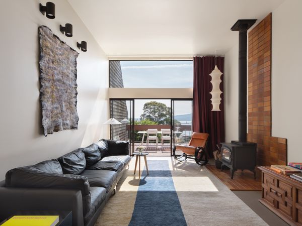 The wood-burning stove lives above a bed of vintage German tile.