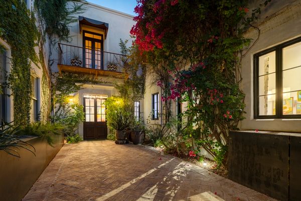 Behind mesquite gates is the home's garden courtyard entry.