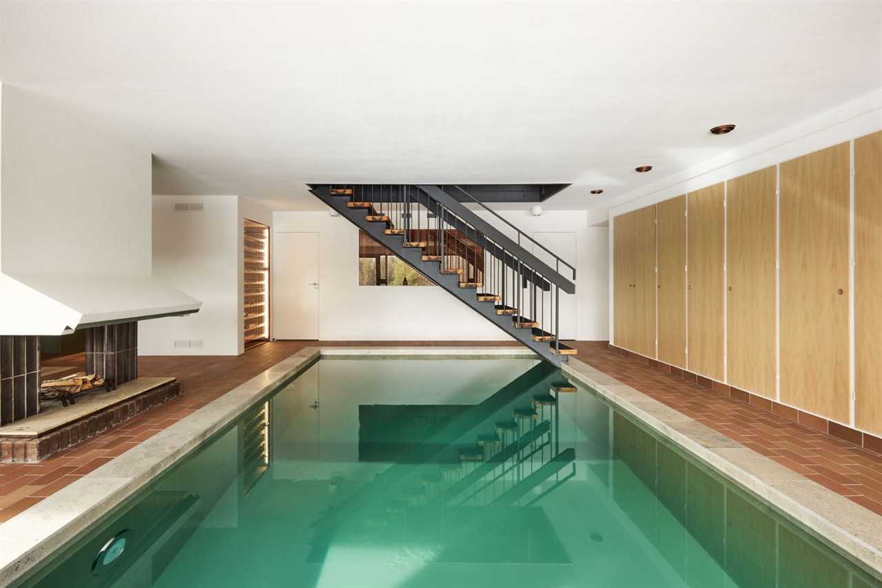 Of Course the Kitchen Matches the Indoor Pool at This Swedish Villa