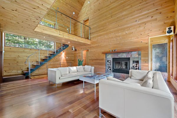 Open riser stairs and a double height living room