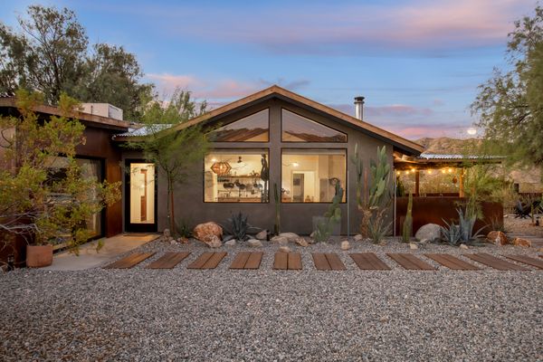 This turnkey getaway comes with two woodburning stoves, a custom kitchen, a hot tub, and a plunge pool.