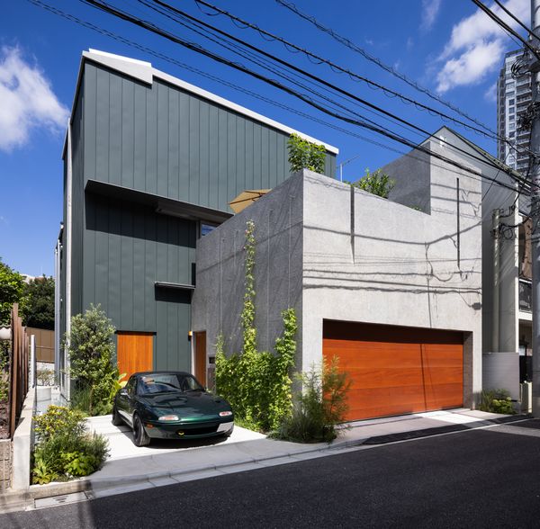 Half-Moon Cutouts Cast Dramatic Light Across This Concrete Home in Tokyo