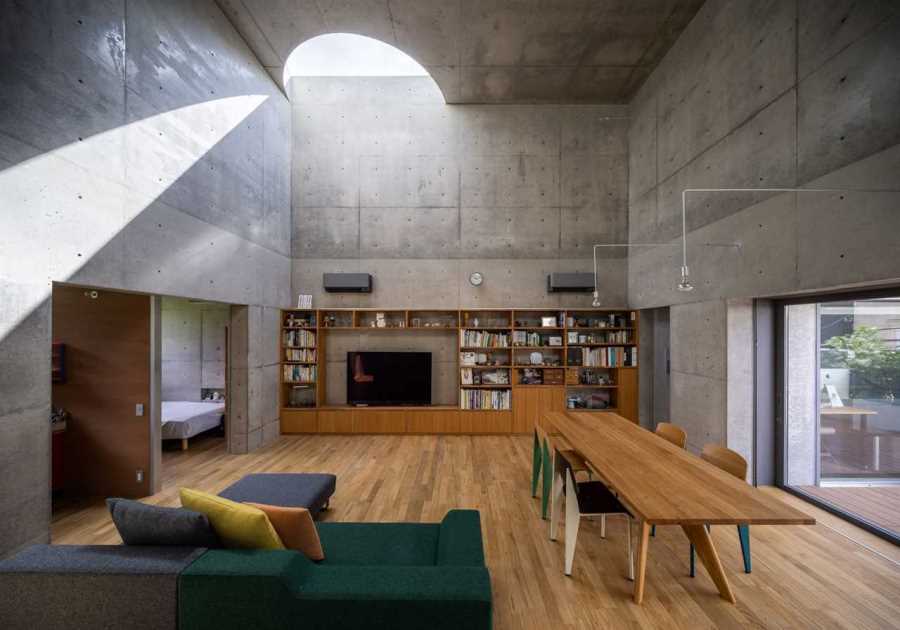 Half-Moon Cutouts Cast Dramatic Light Across This Concrete Home in Tokyo