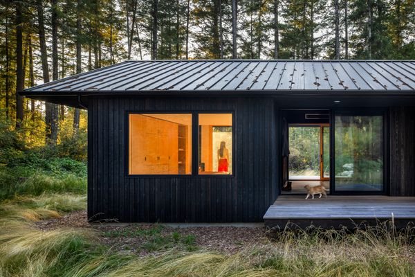 The dark stained cedar exteriors contrast to the light maple interiors, helping the interior of the cabin feel cozy and warm.