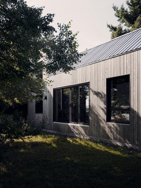<span style="font-family: Theinhardt, -apple-system, BlinkMacSystemFont, "Segoe UI", Roboto, Oxygen-Sans, Ubuntu, Cantarell, "Helvetica Neue", sans-serif;">The exterior is clad in untreated cedar, "so it gets grayer every year,