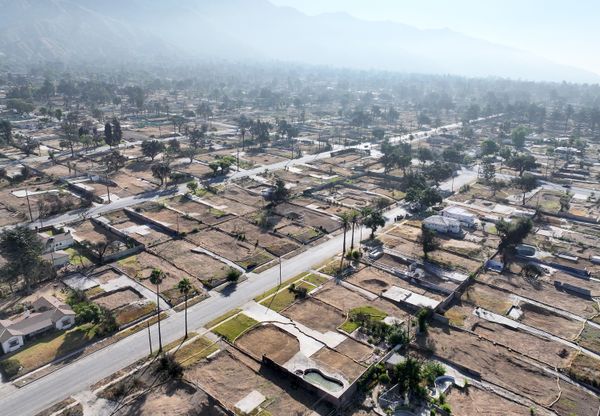 ALTADENA, CALIFORNIA - JULY 03: An aerial view of properties cleared of wildfire debris which burned in the Eaton Fire on July 03, 2025 in Altadena, California. The U.S. Army Corps of Engineers has cleared more than 5,000 properties damaged in the Eaton Fire as the six month anniversary of the devastating Los Angeles wildfires approaches.