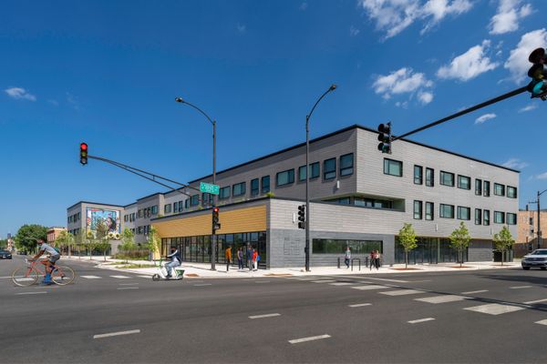 The exterior of Fifth City Commons, <span style="font-family: Theinhardt, -apple-system, BlinkMacSystemFont, &quot;Segoe UI&quot;, Roboto, Oxygen-Sans, Ubuntu, Cantarell, &quot;Helvetica Neue&quot;, sans-serif;">a passive house multifamily building on a series of vacant city-owned lots.</span>