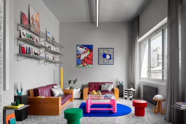 When the rest of the room is neutral, bright colors can help anchor the space and become the stars of the show.