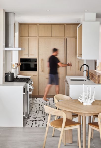 New custom cabinetry in the kitchen grants space for packed weekends with shared family meals.