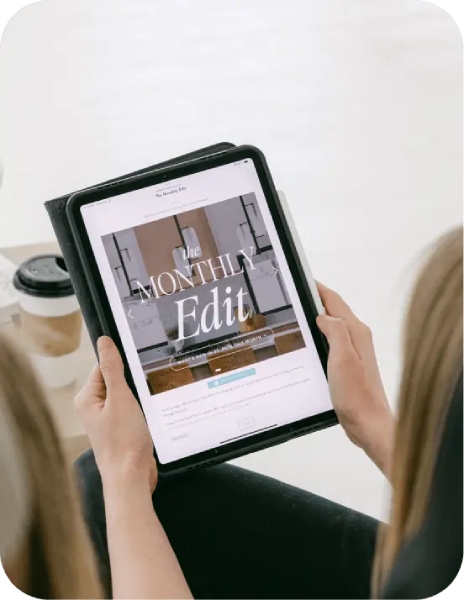 Person looking at a Coffee and Contracts template on their tablet.