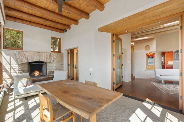 Plastered walls and exposed vigas (the ceiling beams) are a nod to traditional New Mexican architecture.
