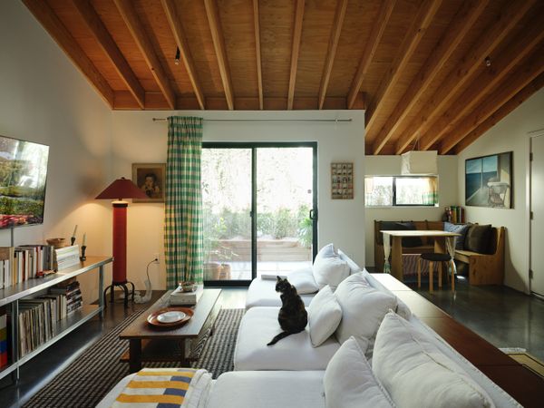 In the Cypress Park section of Los Angeles, Hunter Knight designed and built an urban infill project consisting of a single-family residence and an attached ADU. Tenant Hannah Go, a designer, fabricated the desk/shelving unit in the office that she and her fiancé, Rami Jrade, a songwriter and producer, share when working from home. Inspired by midcentury garden apartments, the ADU features abundant light and exposed wood ceilings.