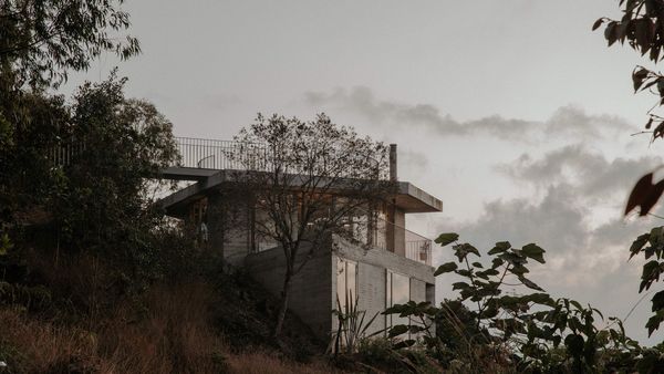 Stacked Geometric Shapes Form a Hillside Concrete Home in Colombia
